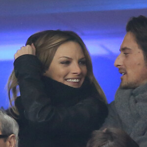 Vincent Cerutti et sa compagne Lavinia - Match entre la France et l'Espagne (0-1) au stade de France à Saint-Denis, le 26 mars 2013.