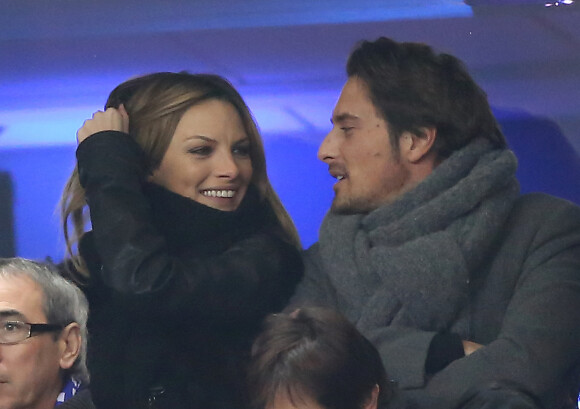 Vincent Cerutti et sa compagne Lavinia - Match entre la France et l'Espagne (0-1) au stade de France à Saint-Denis, le 26 mars 2013.