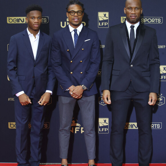 Isaac Drogba, Loïc Rémy et Didier Drogba au photocall de la 28ème cérémonie des trophées UNFP (Union nationale des footballeurs professionnels) au Pavillon d'Armenonville à Paris, France, le 19 mai 2019.