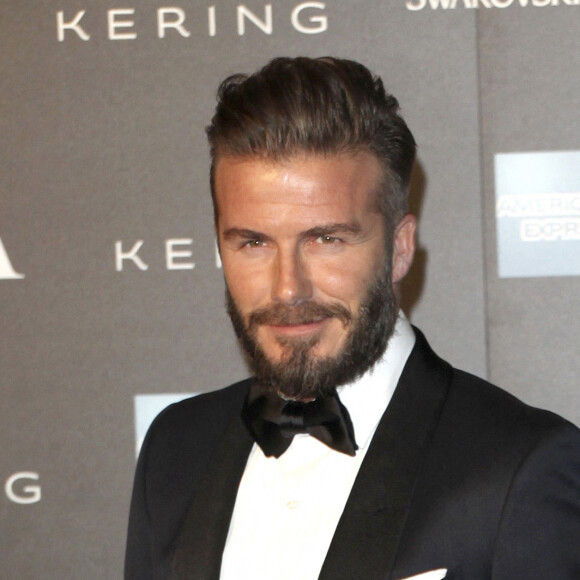 David Beckham et sa femme Victoria Beckham - Photocall du gala "Alexander McQueen : Savage Beauty" au Victoria and Albert Museum à Londres, le 12 mars 2015.