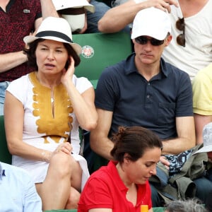 Gilles Bouleau et sa femme Elisabeth Tran-Bouleau à la finale homme des Internationaux de France de tennis de Roland Garros à Paris le 8 juin 2014.