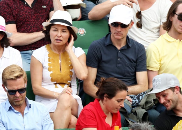 Gilles Bouleau et sa femme Elisabeth Tran-Bouleau à la finale homme des Internationaux de France de tennis de Roland Garros à Paris le 8 juin 2014.