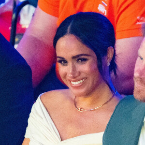 Le prince Harry et Meghan Markle lors de la cérémonie d'ouverture des Invictus Games 2020 à La Haye, le 16 avril 2022. 