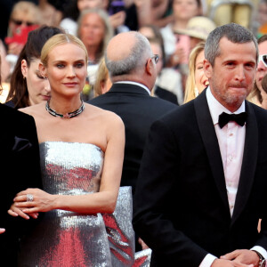 Diane Kruger, accompagné de son amoureux Norman Reedus, juste à côté de Guillaume Canet - Montée des marches pour la cérémonie de clôture du 75ème Festival International du Film de Cannes.