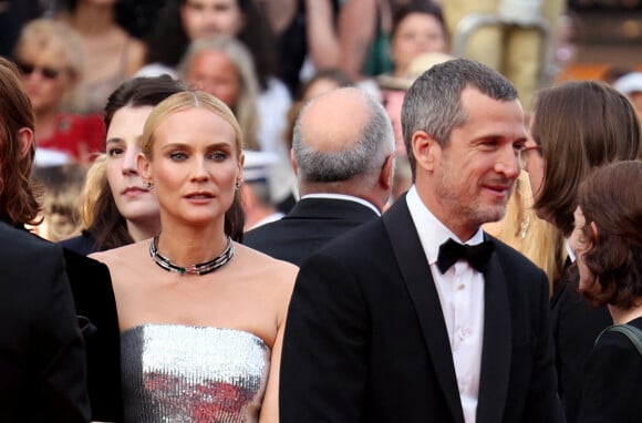 Diane Kruger, accompagné de son amoureux Norman Reedus, juste à côté de Guillaume Canet - Montée des marches pour la cérémonie de clôture du 75ème Festival International du Film de Cannes. Le 28 mai 2022
