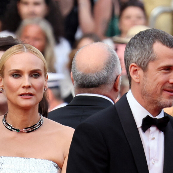 Diane Kruger, accompagné de son amoureux Norman Reedus, juste à côté de Guillaume Canet - Montée des marches pour la cérémonie de clôture du 75ème Festival International du Film de Cannes. Le 28 mai 2022