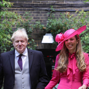 Le premier ministre Boris Johnson et sa femme Carrie Symonds lors de la parade militaire "Trooping the Colour" dans le cadre de la célébration du jubilé de platine (70 ans de règne) de la reine Elizabeth II à Londres, le 2 juin 2022.