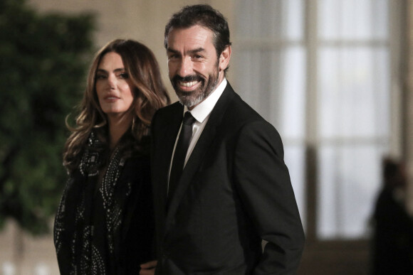 Robert Pires et sa femme Jessica - Dîner au Palais de l'Elysée en l'honneur des 50 ans du Variétés Club de France, à Paris, le 14 octobre 2021. © Stéphane Lemouton / Bestimage