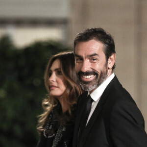 Robert Pires et sa femme Jessica - Dîner au Palais de l'Elysée en l'honneur des 50 ans du Variétés Club de France, à Paris, le 14 octobre 2021. © Stéphane Lemouton / Bestimage