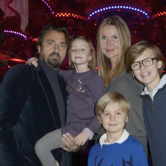 Henri Leconte, sa femme Florentine et leurs enfants Marylou, Ulysse et Jules - Le musée Grevin accueille le Pere Noel Coca-Cola a l'occasion des fetes de fin d'année a Paris, le 20 novembre 2013.