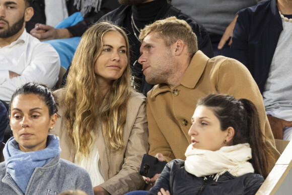 Kevin Mayer et sa compagne Delphine Jariel - Célébrités dans les tribunes des internationaux de France de Roland Garros à Paris le 31 mai 2022. © Cyril Moreau - Dominique Jacovides/Bestimage