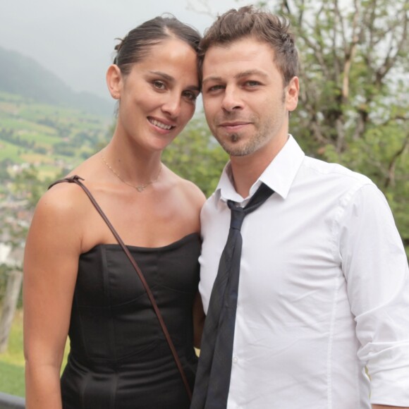 Exclusif - Christophe Maé (Martichon, de son vrai nom) et Nadège Sarron lors du baptême de Joy Hallyday à Lauenen en Suisse en juillet 2009. Le couple s'est marié civilement le 29 juin 2017 et religieusement le 1er juillet 2017 en Corse.