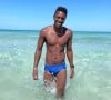 David Baïot en maillot de bain à la plage, août 2021