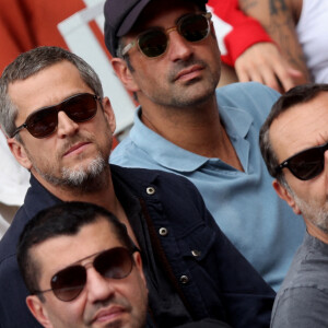Guillaume Canet, Gilles Lellouche dans les tribunes lors des Internationaux de France de Tennis de Roland Garros 2022. Paris, le 5 juin 2022. © Dominique Jacovides/Bestimage 