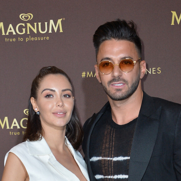 Nabilla Benattia (enceinte) et son mari Thomas Vergara au photocall de l'after party "Magnum x Rita Ora" sur la plage privée Magnum lors du 72ème Festival International du Film de Cannes, France,le 16 mai 2019. © Veeren/Bestimage 
