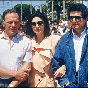 Archives - Jean-Louis Trintignant, Anouk Aimée et Claude Lelouch en 1986 au Festival de Cannes.
