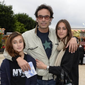 Anthony Delon avec ses filles Liv et Loup - Inauguration de la fete foraine des Tuileries a Paris le 28 juin 2013.