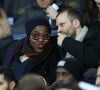 Claudia Tagbo et son compagnon dans les tribunes du Parc des Princes lors du match de football de ligue 1 opposant le Paris Saint-Germain (PSG) au Stade rennais FC à Paris, France, le 27 janvier 2019. Le PSG a gagné 4-1. 