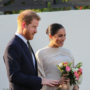 Le prince Harry, duc de Sussex, et Meghan Markle, duchesse de Sussex, enceinte assistent à une réception organisée par l'ambassadeur britannique au Maroc, Thomas Reilly, à la résidence britannique de Rabat, le 24 février 2019, dans le cadre de leur voyage officiel au Maroc. 