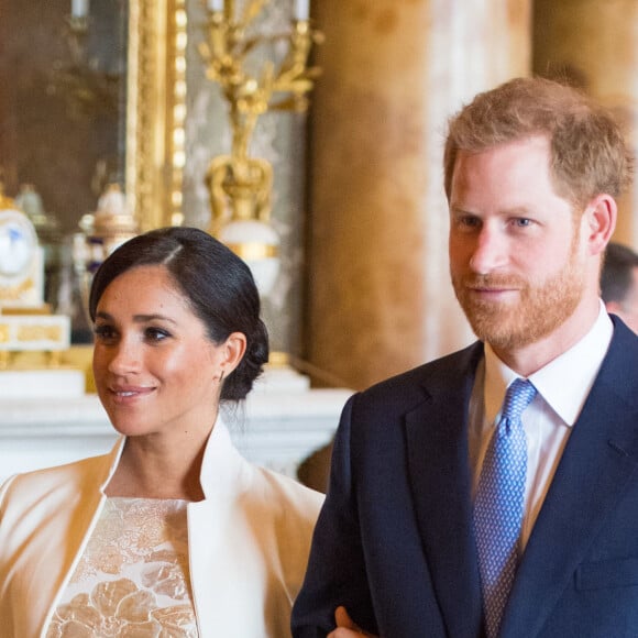 Le prince Harry, duc de Sussex, et Meghan Markle (enceinte), duchesse de Sussex - La famille royale d'Angleterre lors de la réception pour les 50 ans de l'investiture du prince de Galles au palais Buckingham à Londres. Le 5 mars 2019 