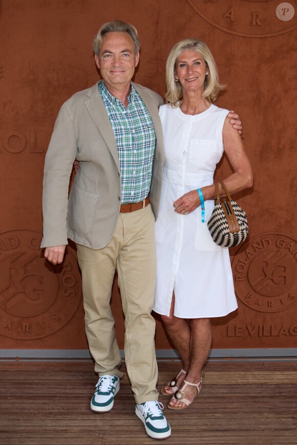 Gilles Cohen et sa femme Karine Paschal au Village Roland Garros lors des Internationaux de France de tennis de Roland Garros 2023, à Paris, France, le 30 mai 2023. © Moreau-Jacovides/Bestimage