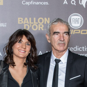 Raymond Domenech et Estelle Denis - Tapis rouge de la cérémonie du Ballon d'or France Football 2018 au Grand Palais à Paris, France, le 3 décembre 2018. le Croate L.Modric remporte le trophée 2018. © Cyril Moreau/Bestimage