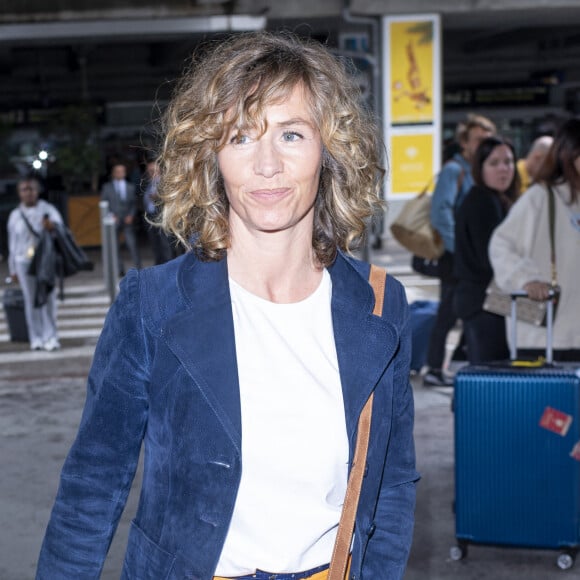 Suivant ainsi ses traces. D'ailleurs, ils connaissent déjà bien le métier.
Cécile de France - Les célébrités arrivent à l'aéroport Nice Côte d'Azur lors du 76ème Festival International du Film de Cannes, à Nice, France, le 20 mai 2023. © Da Silva-Perusseau/Bestimage 