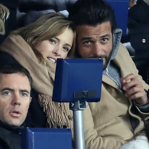 Maxim Nucci et sa compagne Isabelle Ithurburu enceinte assistent au huitième de finale retour de Ligue des Champion, du Paris Saint-Germain contre le Real Madrid au Parc des Princes à Paris le 6 mars 2018. © Cyril Moreau/Bestimage