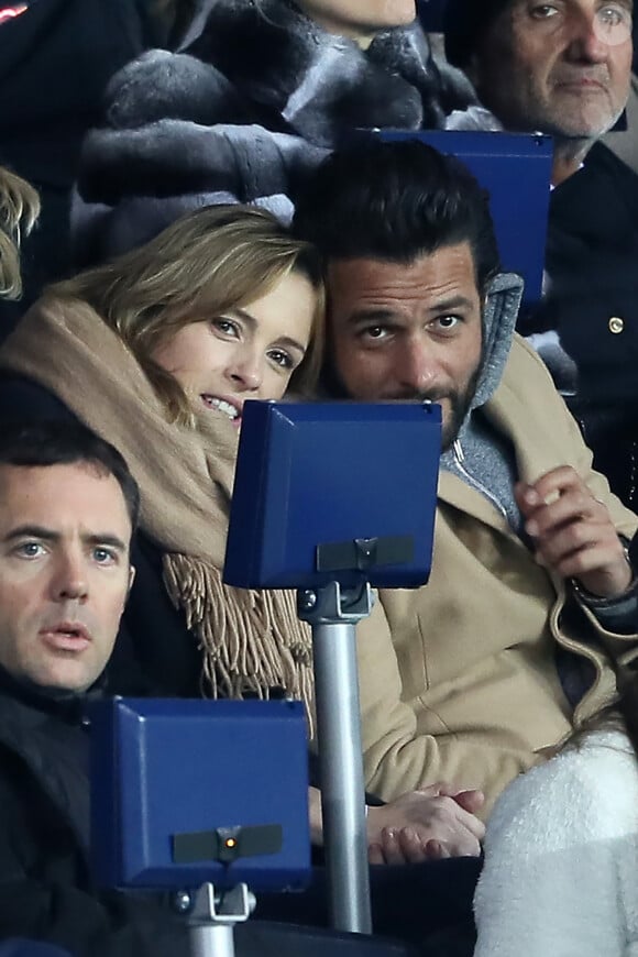 Maxim Nucci et sa compagne Isabelle Ithurburu enceinte assistent au huitième de finale retour de Ligue des Champion, du Paris Saint-Germain contre le Real Madrid au Parc des Princes à Paris le 6 mars 2018. © Cyril Moreau/Bestimage