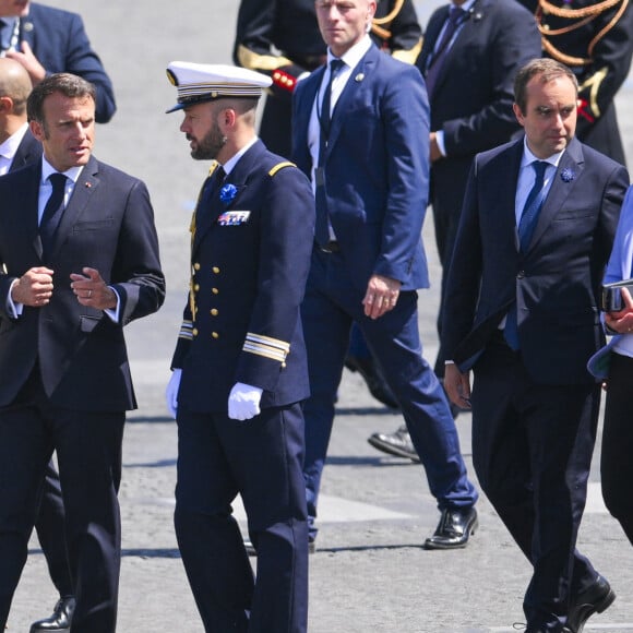 Brigitte Macron aux bras de Emmanuel Macron, président de la République française suivis par Elisabeth Borne - Premiere Ministre et de Sebastien Lecornu - Ministre des Armees lors de la cérémonie du 143ème défilé militaire du 14 juillet, jour de la Fête Nationale, sur les Champs-Elysées et la place de la Concorde, à Paris, France, le 14 juillet 2023. © Jean-Baptiste Autissier/Panoramic/Bestimage  Bastille Day parade on July 14, 2023, in Paris, France. France prepares to celebrate the national holiday known as Bastille Day on July 14, with heightened security and a fireworks sale ban following recent violent anti-government protests. 