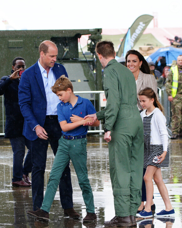 Le prince William, prince de Galles, et Catherine (Kate) Middleton, princesse de Galles, avec leurs enfants le prince George de Galles, et la princesse Charlotte de Galles, lors d'une visite au Royal International Air Tattoo (RIAT) à RAF Fairford, le 14 juillet 2023. 