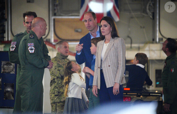 Le prince William, prince de Galles, et Catherine (Kate) Middleton, princesse de Galles, avec leurs enfants le prince George de Galles, et la princesse Charlotte de Galles, lors d'une visite au Royal International Air Tattoo (RIAT) à RAF Fairford, le 14 juillet 2023. 