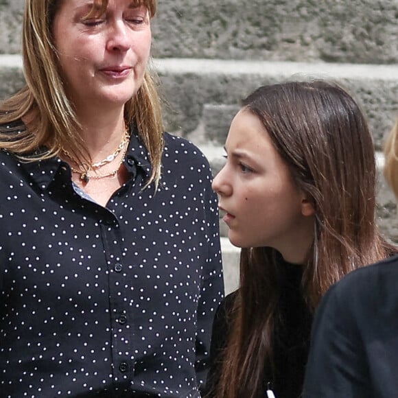 Jo Attal, ( with a Union Jack on her bag) daughter of Charlotte Gainsbourg and Yvan Attal during the funeral at Saint Roch Church in Paris, France on July 24, 2023, of British-born singer and actor Jane Birkin, who died on July 16, 2023 in Paris aged 76. Photo by Nasser Berzane/ABACAPRESS.COM 