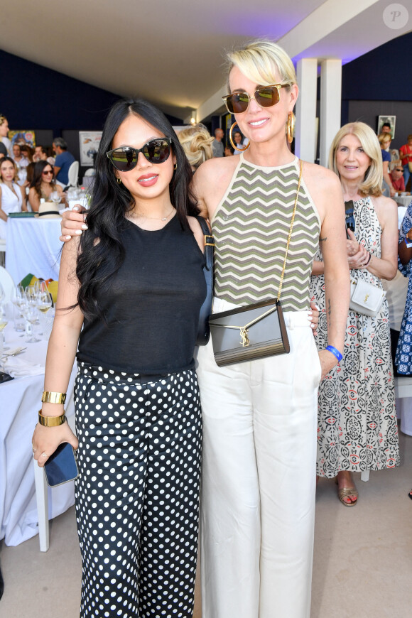 Exclusif - Laeticia Hallyday et sa fille Joy dans l'Espace VIP lors de la 9ème édition du "Longines Paris Eiffel Jumping" au Champ de Mars à Paris, France, le 25 juin 2023. © Perusseau-Veeren/Bestimage 