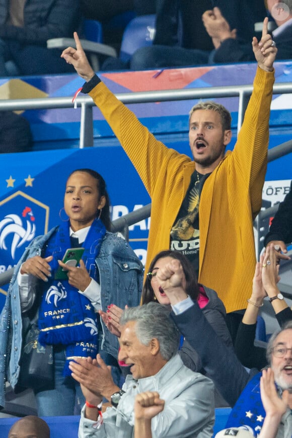 M. Pokora (Matt Pokora), sa femme Christina Milian assistent au match de la 5ème et avant-dernière journée de Ligue des nations entre la France et l'Autriche (2-0) au Stade de France à Saint-Denis le 22 septembre 2022.