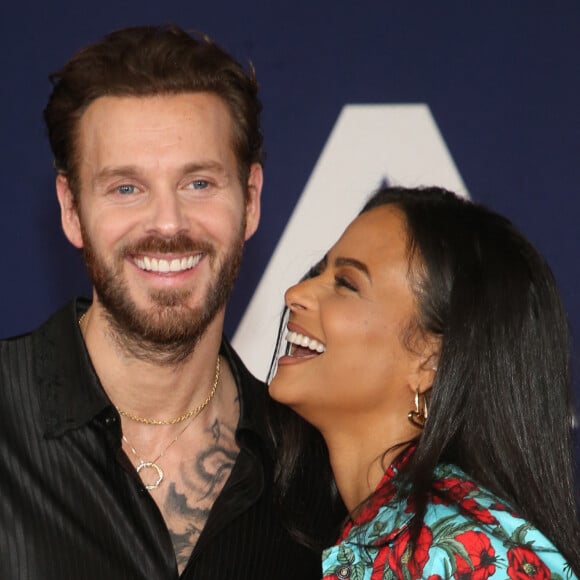 Matt Pokora et sa femme Christina Milian au photocall lors de la première du film "Ambulance" à Los Angeles le 4 avril 2022. 