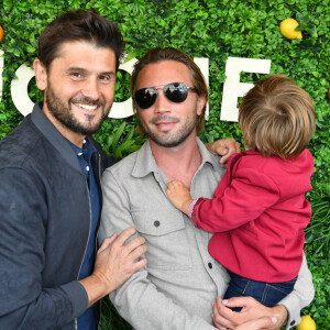 Christophe Beaugrand, son mari Ghislain Gerin et leur fils Valentin - Soirée d'anniversaire des 5 ans de la marque Joone, sur la péniche La Barge à Issy-les-Moulineaux. Paris, le 30 juin 2022 © Veeren / Bestimage