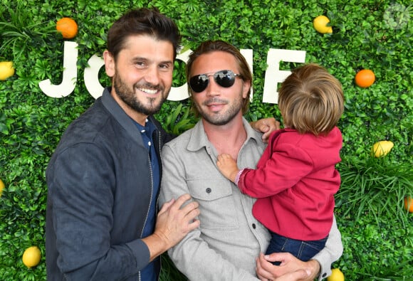 Christophe Beaugrand, son mari Ghislain Gerin et leur fils Valentin - Soirée d'anniversaire des 5 ans de la marque Joone, sur la péniche La Barge à Issy-les-Moulineaux. Paris, le 30 juin 2022 © Veeren / Bestimage