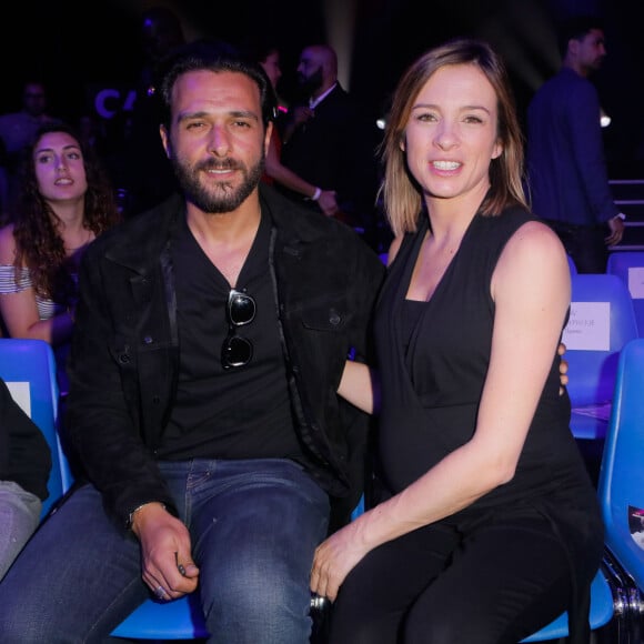 Maxim Nucci (Yodelice) et sa compagne enceinte Isabelle Ithurburu assistent au match de boxe de Tony Yoka au palais des sports de Paris, le 23 juin 2018 © Veeren-CVS/Bestimage