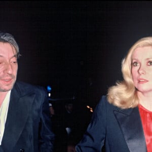 Archives - Serge Gainsbourg et Catherine Deneuve lors d'une soirée "Cartier".
