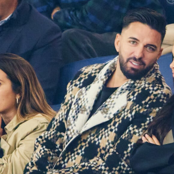 Nabilla et Thomas Vergara - People dans les tribunes lors du match de football Ligue 1 Uber Eats opposant le PSG à l'OM (4-0) au Parc des Princes à Paris le 24 septembre 2023. © Cyril Moreau/Bestimage