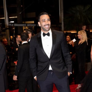 "Je devais parler avec elles sans dire qui j'étais. Je devais pas dire mon identité, ni mon nom, ni rien", explique Adil Rami
 
Adil Rami - Montée des marches du film "Novembre" lors du 75ème Festival International du Film de Cannes, le 22 mai 2022. © Cyril Moreau / Bestimage