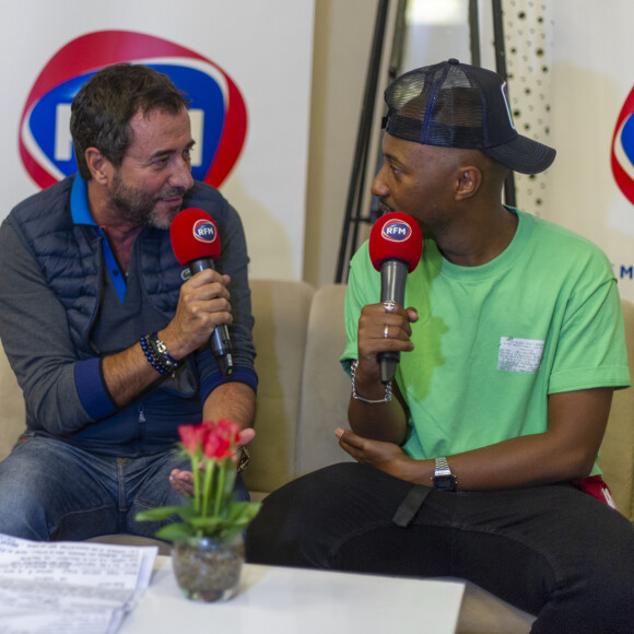 Exclusif - Bernard Montiel et Soprano - Interview RFM lors de la 13ème édition du Concert pour la Tolérance 2019 à Agadir au Maroc, qui sera diffusé le 16 novembre 2019 sur W9. Le 19 octobre 2019 W9 vous donne rendez-vous pour une soirée événement, "La grande soirée de Soprano", enregistré à Agadir au Maroc devant 220 000 personnes pour sa 13ème édition. Pour défendre les valeurs qui leur sont chères telles que le respect, la fraternité et la paix, Soprano a convié ses amis artistes pour un show d'exception ! Tous ont accepté l'invitation de Soprano pour faire de ce concert une grande soirée inoubliable avec des duos inédits ! © Perusseau-Veeren / Bestimage 