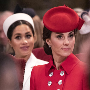 Catherine Kate Middleton, duchesse de Cambridge, Meghan Markle, enceinte, duchesse de Sussex lors de la messe en l'honneur de la journée du Commonwealth à l'abbaye de Westminster à Londres le 11 mars 2019.  11th March 2019 London UK Britain's Queen Elizabeth is joined by Prince Charles, Camilla, Duchess of Cornwall, Prince William and Catherine, Duchess of Cambridge, Prince Harry and Meghan, Duchess of Sussex and Prince Andrew at the Commonwealth Service at Westminster Abbey in London, Monday, March 11, 2019. Commonwealth Day has a special significance this year, as 2019 marks the 70th anniversary of the modern Commonwealth - a global network of 53 countries and almost 2.4 billion people, a third of the world's population, of whom 60 percent are under 30 years old. Also acting is British Prime Minister Theresa May. 