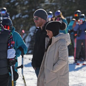 Le prince Harry, duc de Sussex et Meghan Markle, duchesse de Sussex, en visite au camp d'entrainement des athlètes des Invictus Games 2024 à Whistler en Colombie Britannique, le 14 février 2024. 