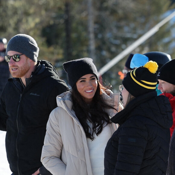 Le prince Harry, duc de Sussex et Meghan Markle, duchesse de Sussex, en visite au camp d'entrainement des athlètes des Invictus Games 2024 à Whistler en Colombie Britannique, le 14 février 2024. 