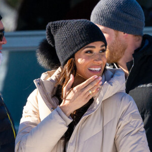 Le prince Harry, duc de Sussex et Meghan Markle, duchesse de Sussex, en visite au camp d'entrainement des athlètes des Invictus Games 2024 à Whistler en Colombie Britannique, le 14 février 2024. 