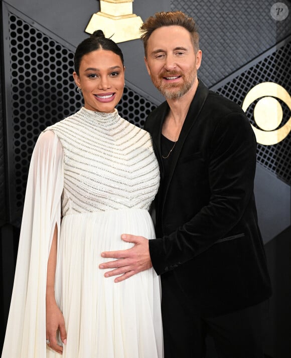 Le DJ français est devenu papa pour la troisième fois
David Guetta et sa compagne Jessica Ledon, enceinte - Arrivées à la 66ème édition des Grammy Awards à la Crypto.com Arena à Los Angeles le 4 février 2024. 