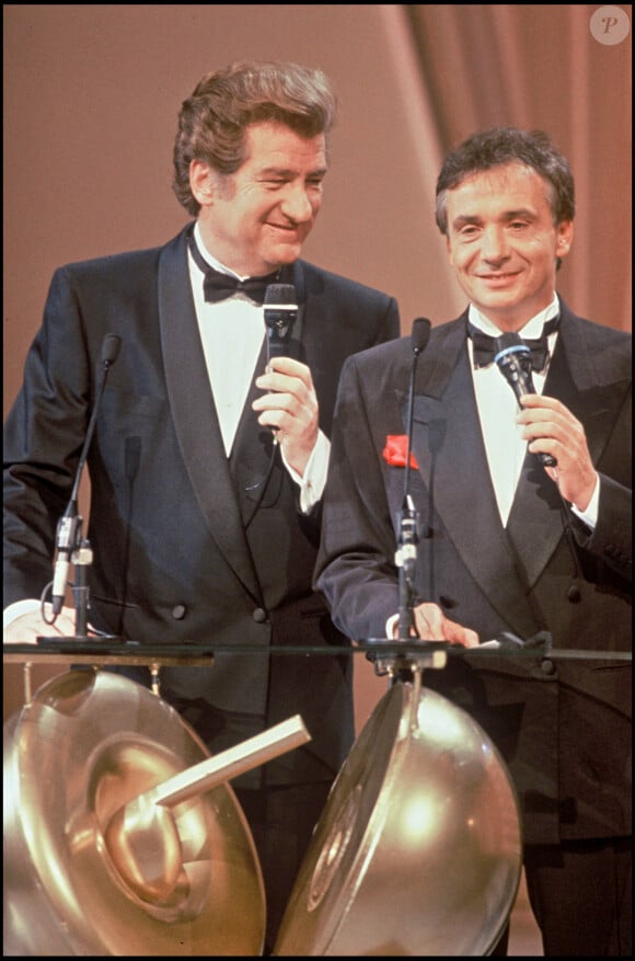 Mais aussi l'ami du chanteur, Eddy Mitchell. 
Archives - Eddy Mitchell et Michel sardou aux Victoires de la Musique, 1992.
