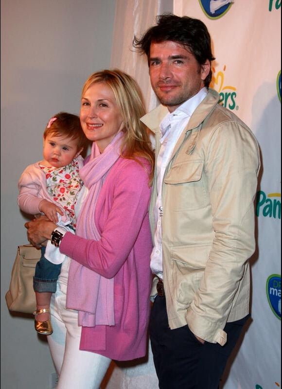 Kelly Rutherford et sa fille Helena, et Matthew Settle, lors de la soirée Pampers à New York, le 18 mars 2010